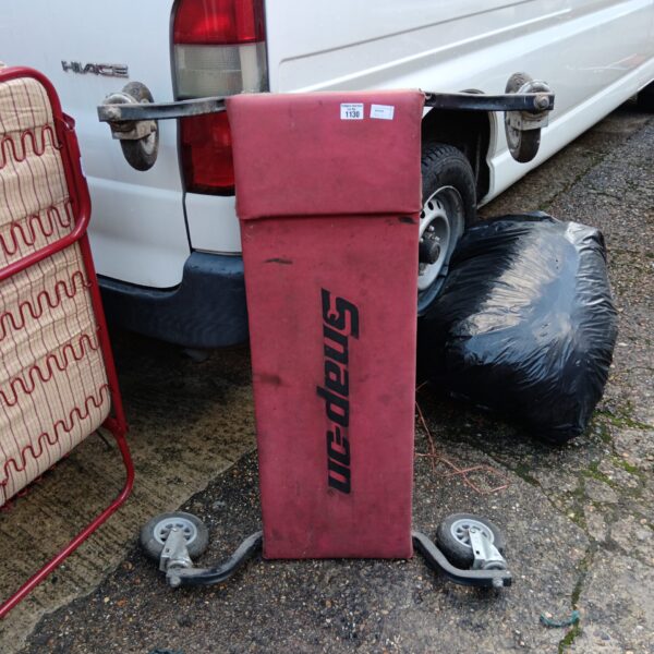 Used Snap On mechanics creeper board for automotive repairs.