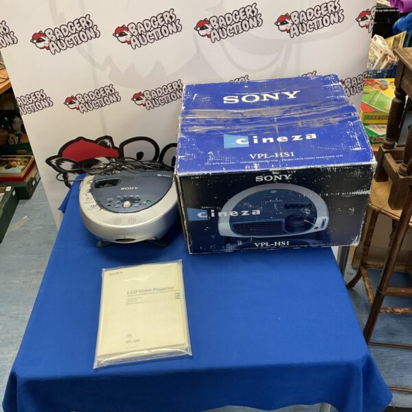 Sony Cineza VPL-HS1 LCD projector displayed on a table.