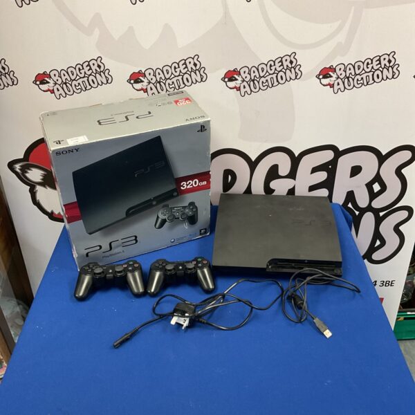 Sony Playstation 3 console with two wireless controllers for gaming.