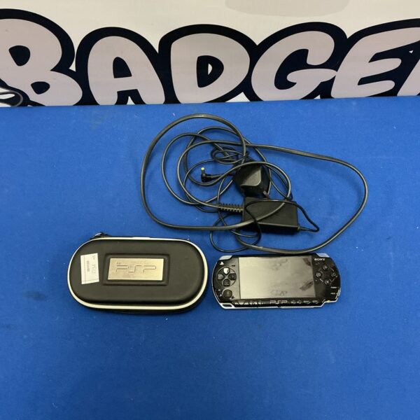 Front view of a silver Sony PSP console with charger.