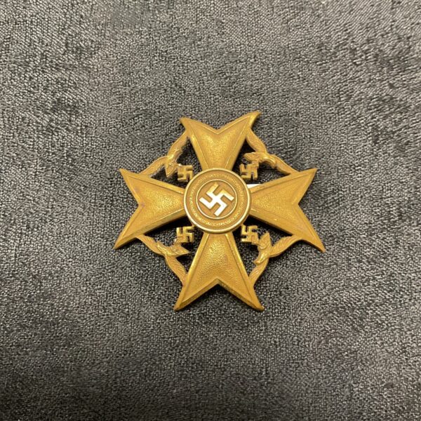 Front view of a Spanish Bronze Cross with swastika.