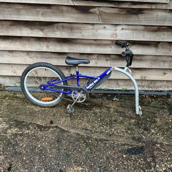 Blue vintage Spoken Joe bike trailer for children.