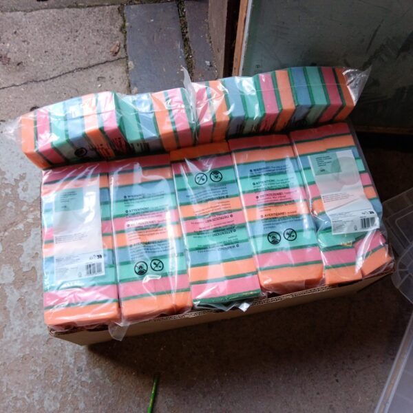 Box of new sponge scourer cleaning pads for kitchen cleaning.