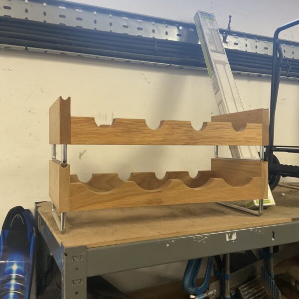Wooden stackable wine bottle rack for home storage.
