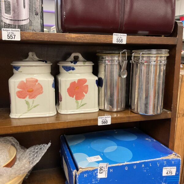 Vintage stainless steel canisters and Royal Winton coffee jars for kitchen storage.