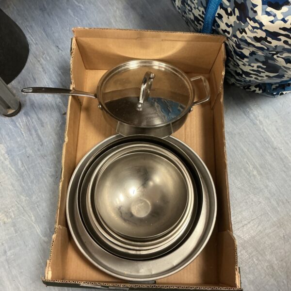 Vintage stainless steel cooking bowls, a kitchenalia collection.