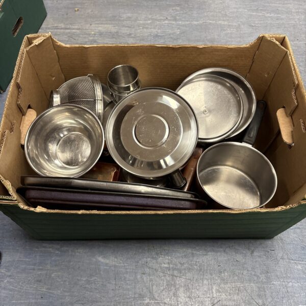 Stainless steel kitchenware lot including bowls and pans.