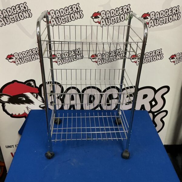 Stainless steel wheeled storage unit with multiple tiers.
