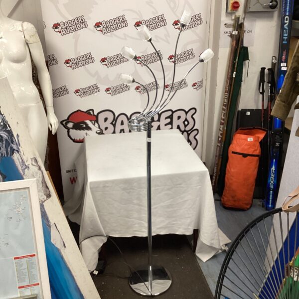 Modern standard lamp with brushed chrome finish and white shade.