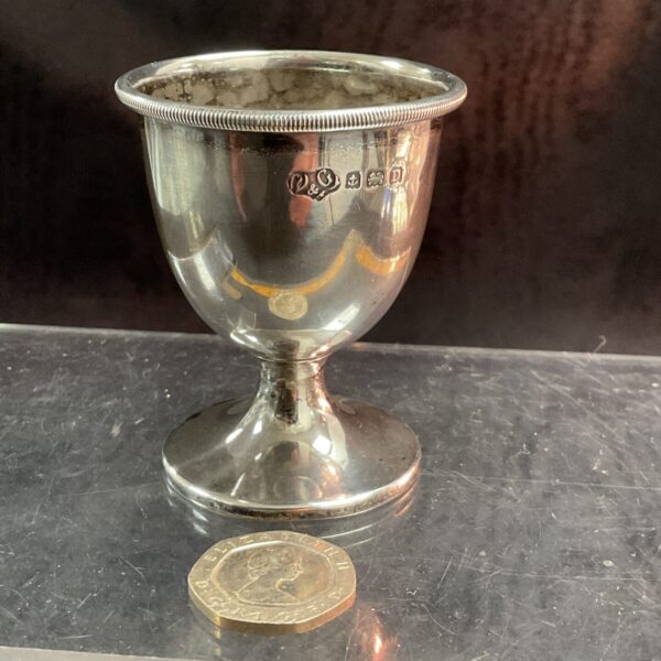 Hallmarked sterling silver egg cup, antique collectible silverware.