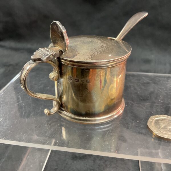 Antique sterling silver mustard pot with spoon and lid.