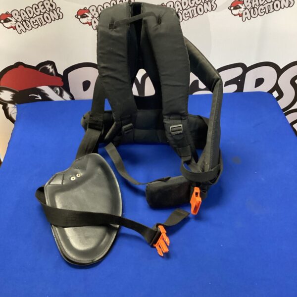 Padded Stihl harness for comfortable brush cutter operation.