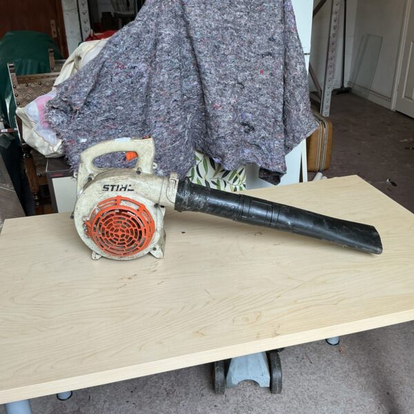 Used Stihl petrol leaf blower for garden maintenance.