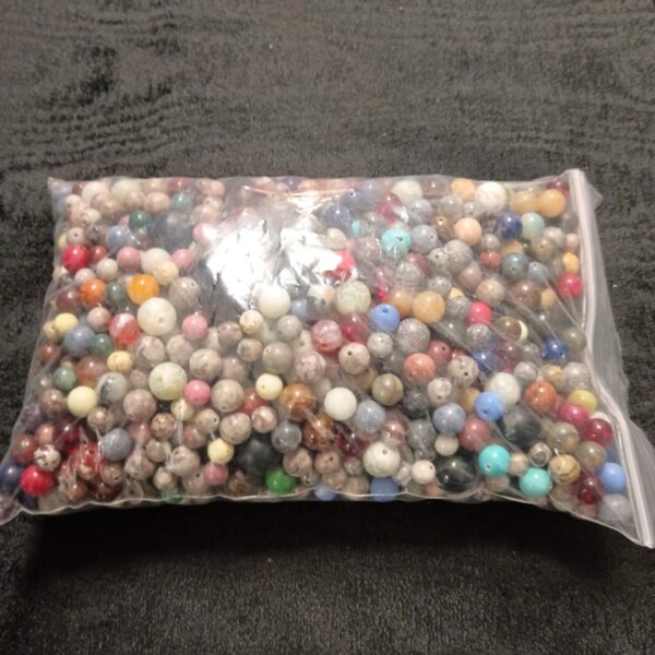 Mixed lot of colourful stone beads for jewellery making.