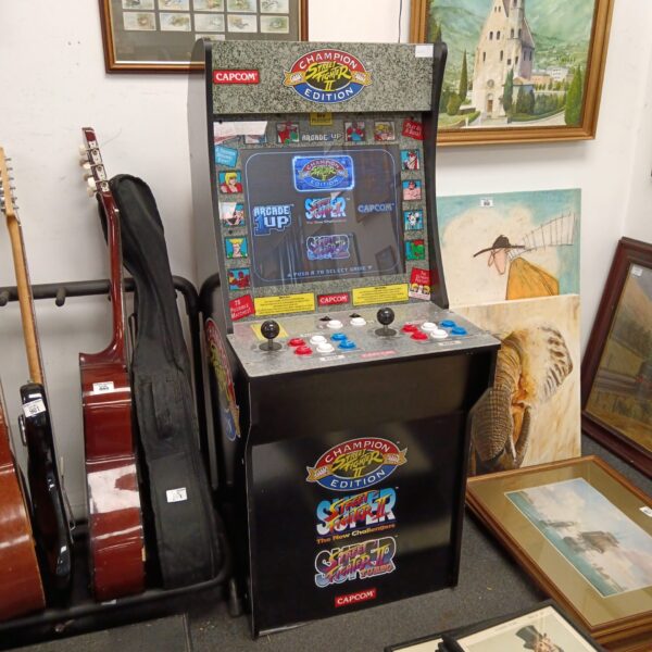 Front view of a vintage Street Fighter II arcade cabinet.