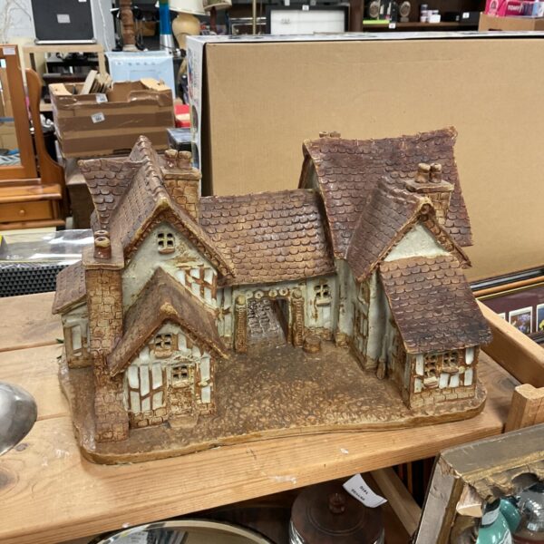 Detailed view of a vintage Suffolk pottery gatehouse cottage.