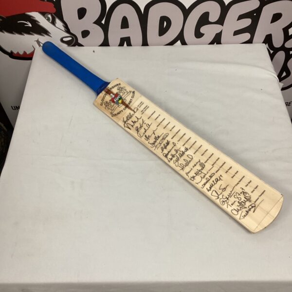 Signed Surridge Gloucestershire cricket bat with team signatures.