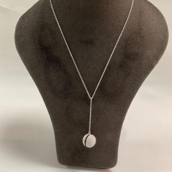 Sparkling Swarovski glitter ball pendant necklace on a display.