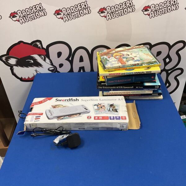 Swordfish SuperSlim laminator with vintage books and annuals.