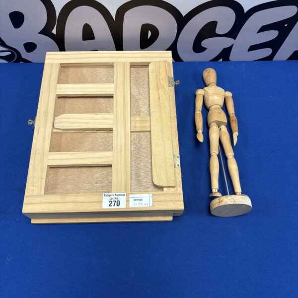 Wooden tabletop box easel with adjustable figurine for artists.