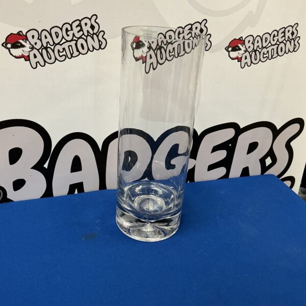 Tall clear glass vase for floral arrangements and home decor.