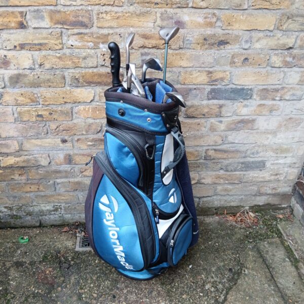 TaylorMade golf bag with a selection of clubs including Sundridge irons.