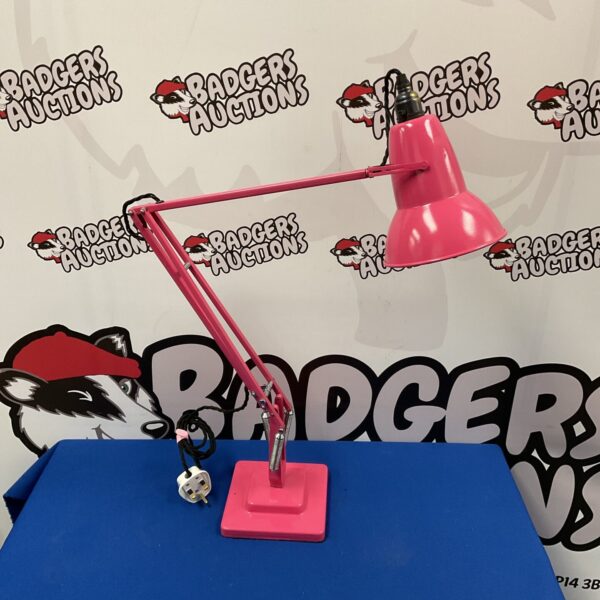 Restored vintage pink Terry Herbert Anglepoise lamp on a white background.