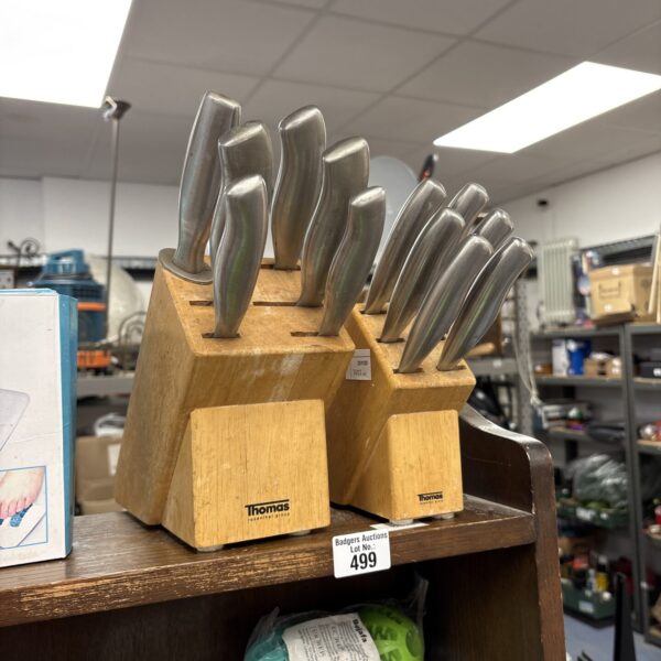Two Thomas knife block sets with wooden blocks and assorted kitchen knives.
