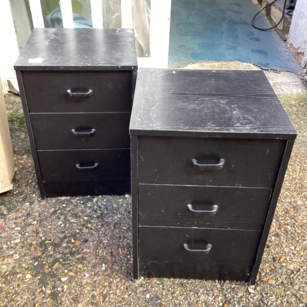 Three drawer bedside cabinets in a bedroom setting.