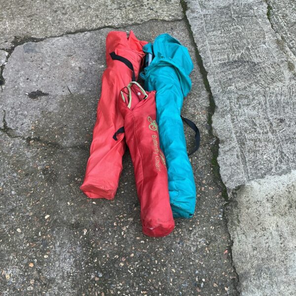 Lot of three colourful folding camping chairs for outdoor use.