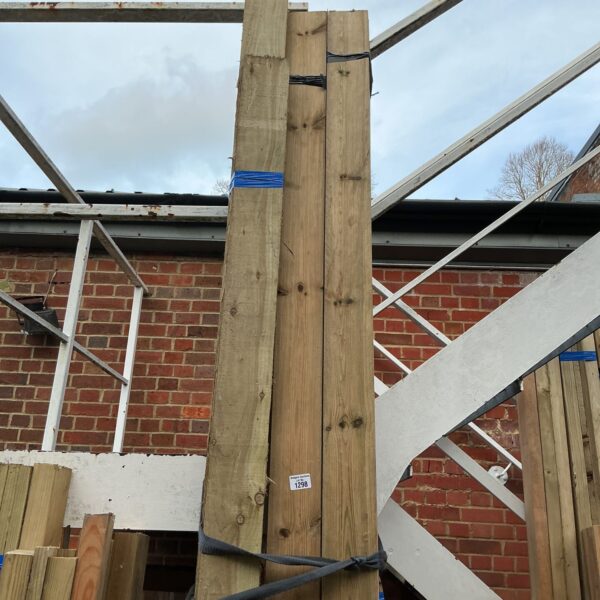 Three bundles of 10ft timber stacked outdoors, ready for construction.