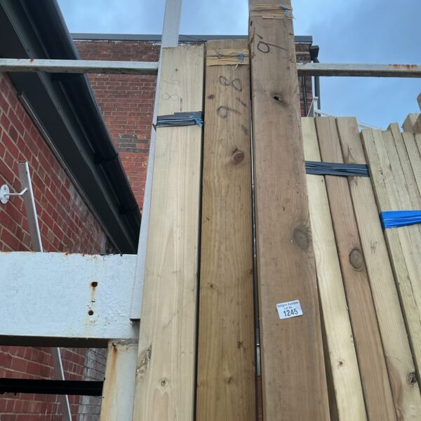 Stacked bundles of timber for construction and DIY projects.