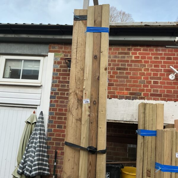 Strapped bundles of timber ready for construction or DIY projects.