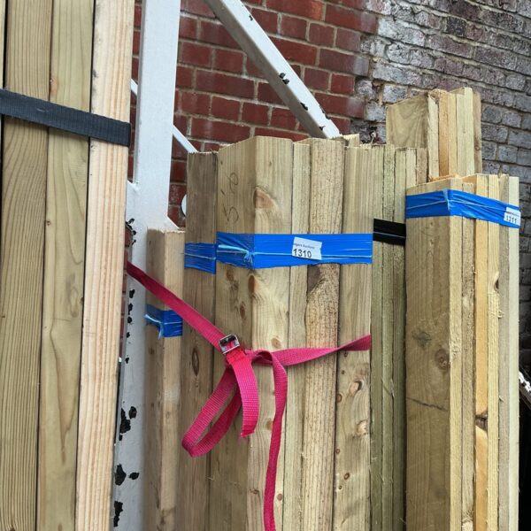 Strapped bundles of timber ready for construction or DIY projects.