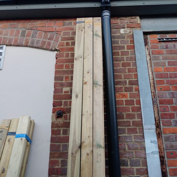 Bundle of eleven foot timber lengths for construction projects.