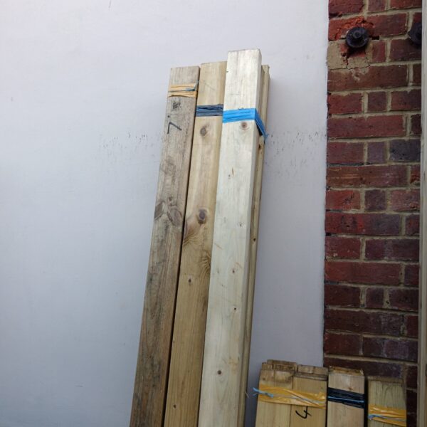 Bundle of 7ft timber lengths for construction projects.