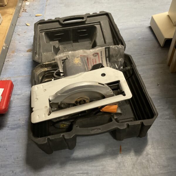 Titan circular saw in its original carrying case, ready for use.