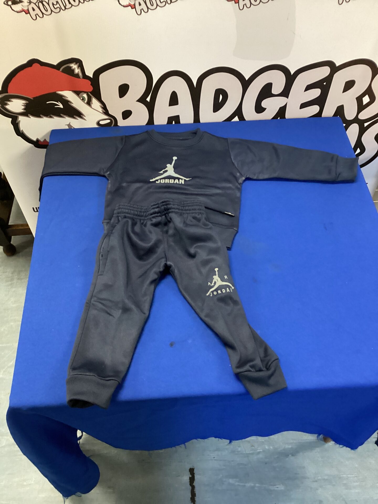 Navy blue toddler Air Jordan tracksuit, sporty and comfortable.
