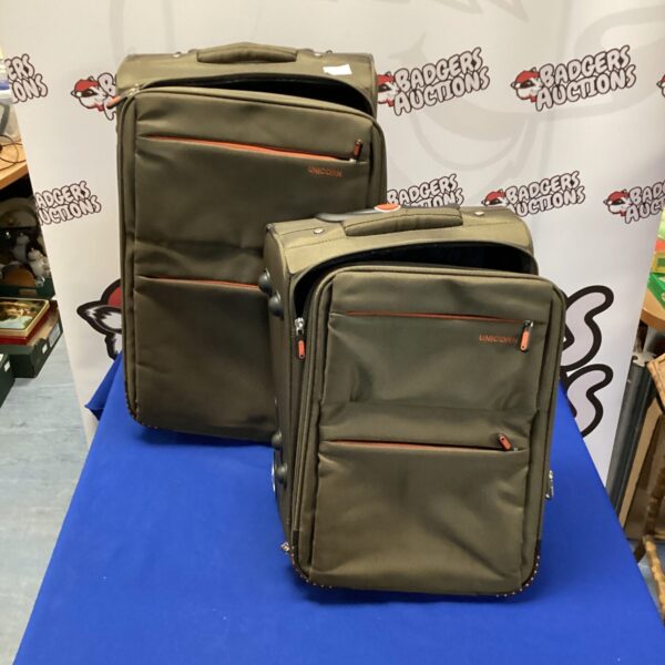Front view of a colourful unicorn suitcase set with wheels.