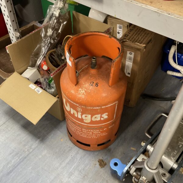 Used Unigas patio gas canister for outdoor heating and cooking.
