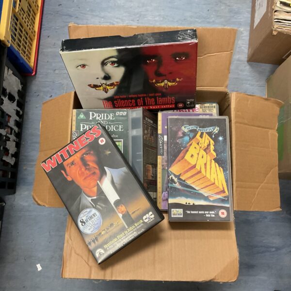 VHS film collection including sealed Silence of the Lambs box.