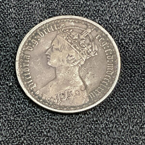Silver Victorian florin coin showing Queen Victoria's portrait.