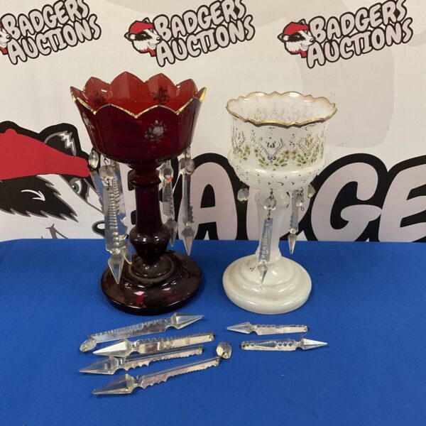 Antique Victorian glass lustres with ruby red bowls and hanging arms.