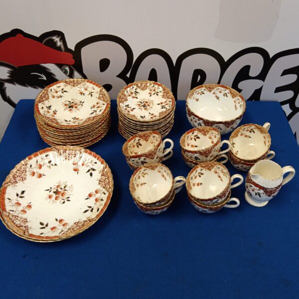 Victorian Indian Tree pattern tea set with plates, cups, and saucers.
