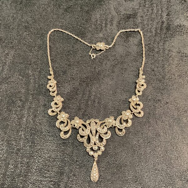 Vintage silver marcasite necklace with pendant detail.
