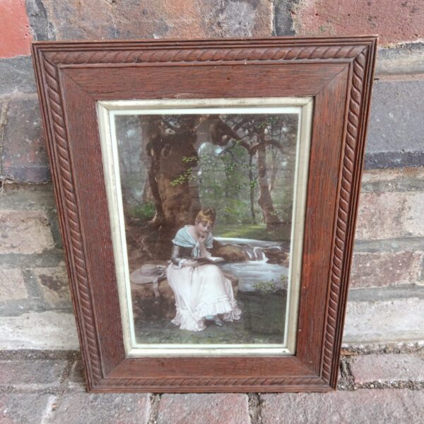 Antique Victorian oil painting on opaque glass of a lady reading.