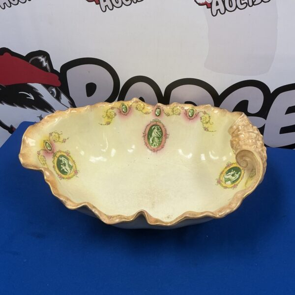 Antique Victorian porcelain shell shaped bowl with floral details.