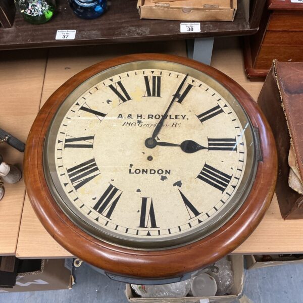 Victorian A & H Rowley railway clock with a large white dial.