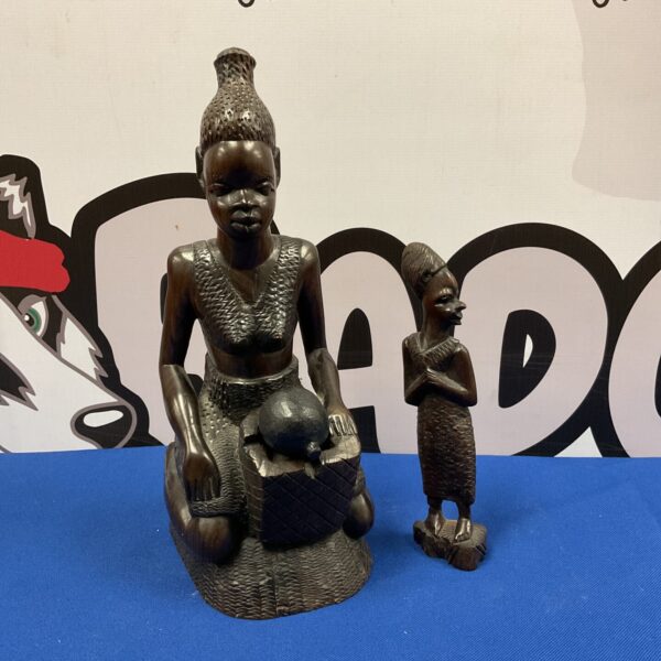 Vintage African carved wood figures of tribal women sculptures.