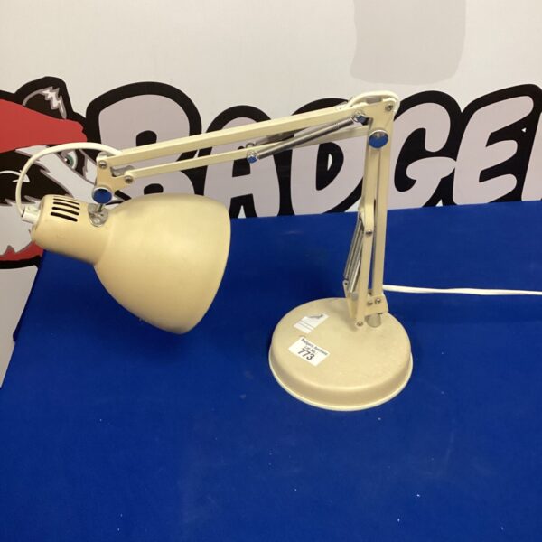 Vintage Anglepoise lamp with adjustable arm and circular base.